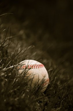 Old Baseball in the Grass clipart