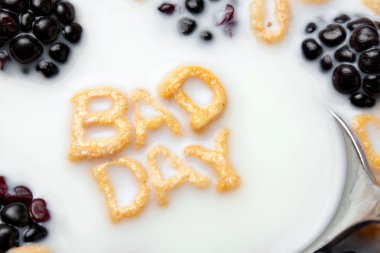 Words BAD DAY Spelled In Cereal Letters clipart