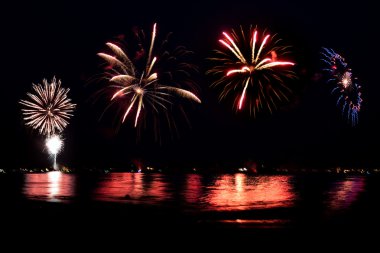 Fireworks Grand Finale Over Water with Reflections clipart