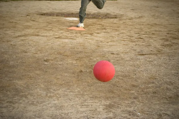 Red kickball approach — Stock Photo, Image