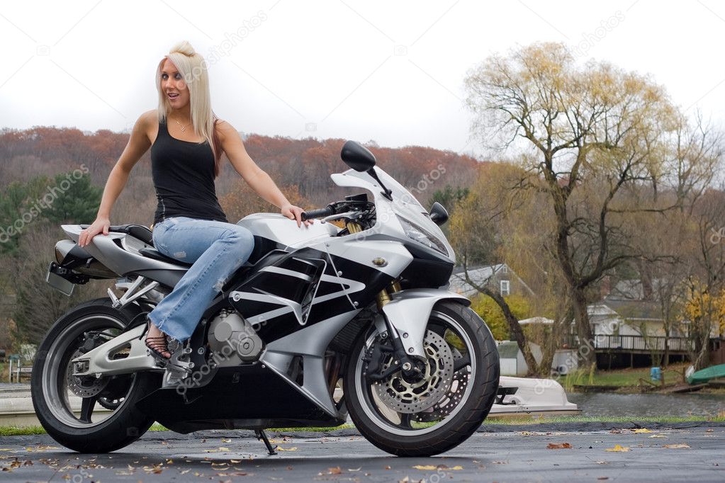Blonde Woman On a Motorcycle — Stock Photo © ArenaCreative #9241659