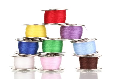 Metal spools of thread isolated on white clipart