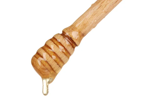 Μέλι ξύλινη κουτάλα με το μέλι που απομονώνονται σε λευκό — Φωτογραφία Αρχείου