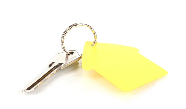 Key with house-shaped charm isolated on white — Stock Photo, Image