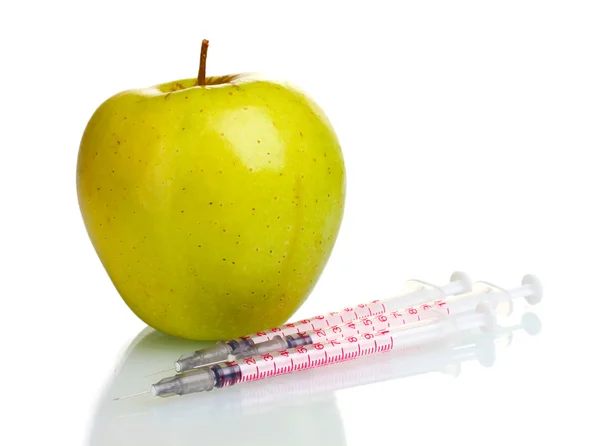 Green apple and syringes isolated on white — Stock Photo, Image