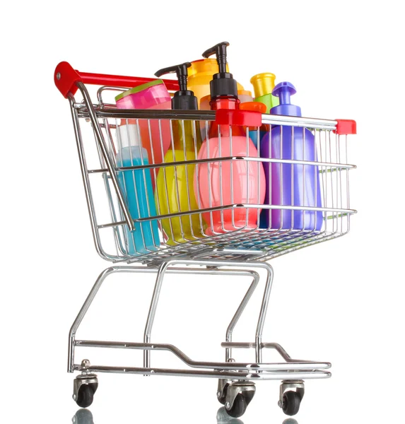 Carrinho de compras com garrafas de detergente isolado em branco — Fotografia de Stock