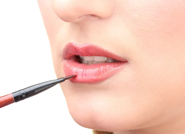 Beautiful woman applying lip gloss — Stock Photo, Image