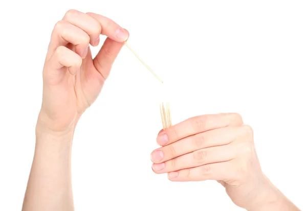 Χέρι που ρίχνουν οδοντογλυφίδα που απομονώνονται σε λευκό — Φωτογραφία Αρχείου