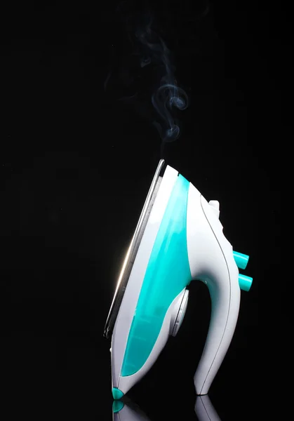 stock image Electric iron on black