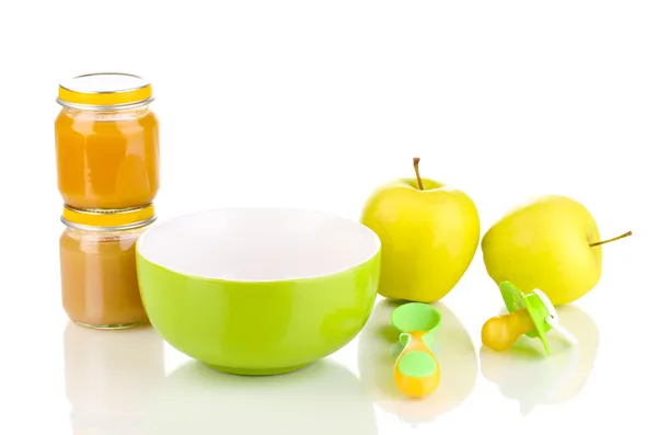 Jars of baby puree with plate, spoon and apples isolated on white — Stock Photo, Image