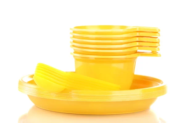 Bright yellow plastic tableware isolated on white — Stock Photo, Image