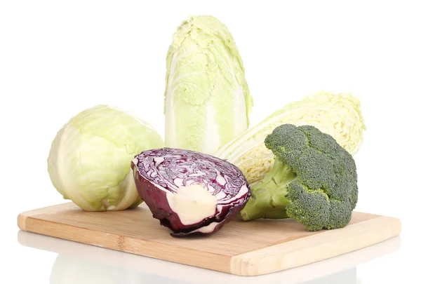 Cabbages and broccoli on wooden chopping board isolated on white — Stock Photo, Image