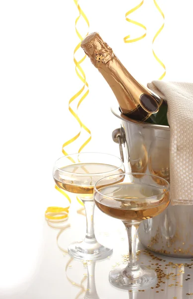 Champagne bottle in bucket with ice and glasses of champagne, isolated on white — Stock Photo, Image