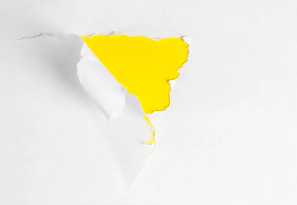 Torn paper with yellow background — Stock Photo, Image