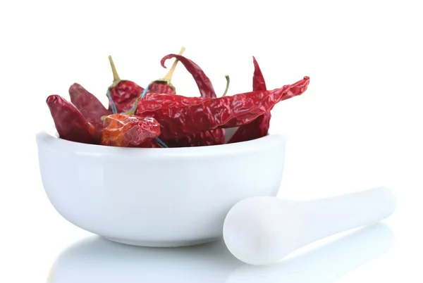 Stock image White mortar and pestle with red peppers