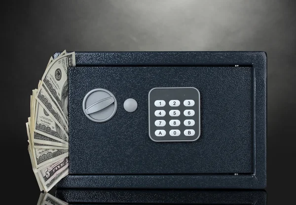 Safe with dollars on grey background — Stock Photo, Image