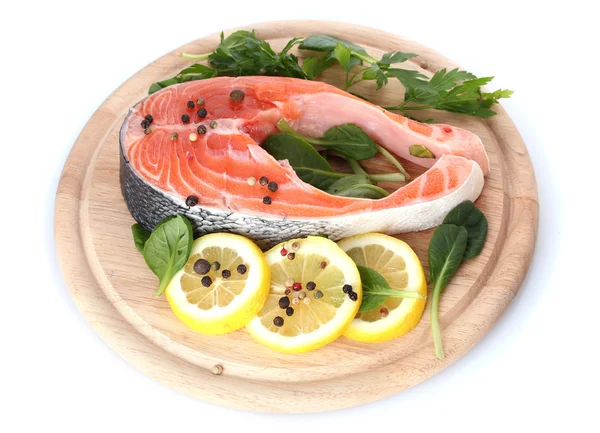 Red fish with lemon and parsley on wooden cutting board isolated on white — Stock Photo, Image