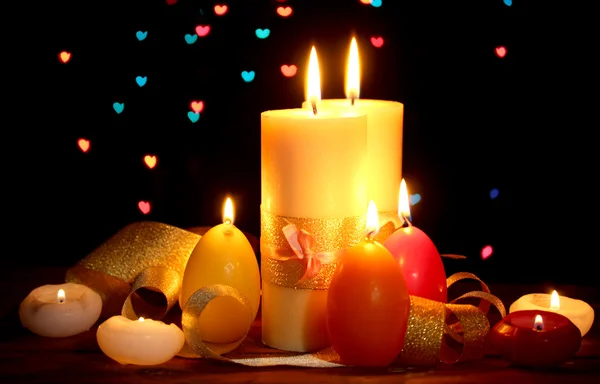 Beautiful candle and decor on wooden table on bright background — Stock Photo, Image
