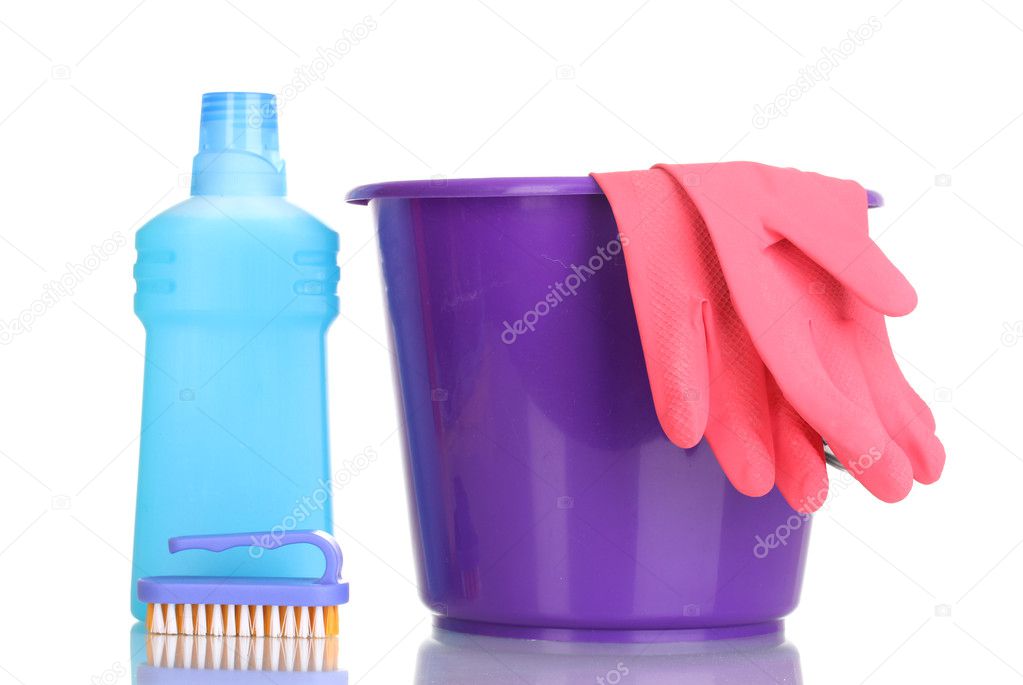 Detergent and bucket with gloves isolated on white
