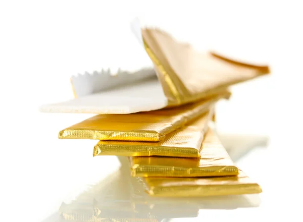 Chewing gums wrapped in golden foil, isolated on white — Stock Photo, Image