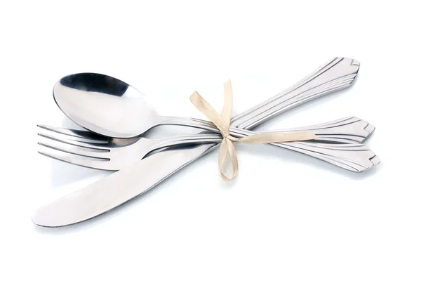 Silver fork, spoon and knife tied with ribbon isolated on white — Stock Photo, Image