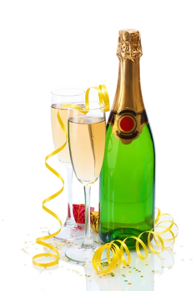 Glasses and bottle of champagne, gifts and serpentine isolated on a white — Stock Photo, Image