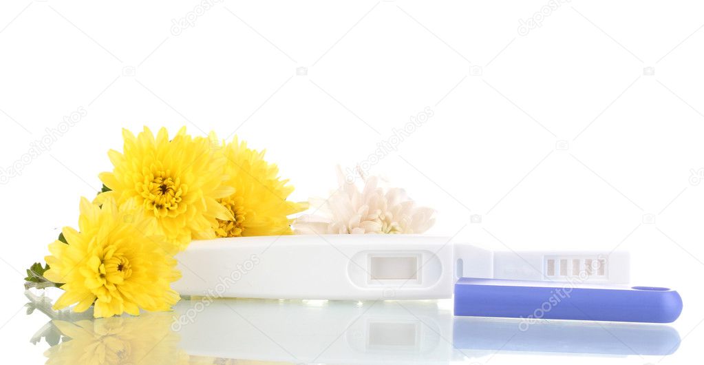 Pregnancy test and flowers isolated on white