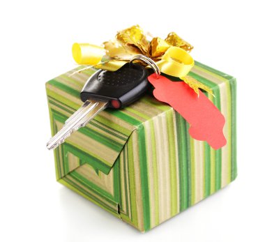 Car key with charm on gift box isolated on white clipart