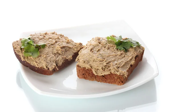 Fresh pate on bread on white plate isolated on white — Stock Photo, Image