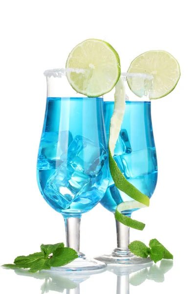 Blue cocktail in glasses with ice and sugar isolated on white — Stock Photo, Image