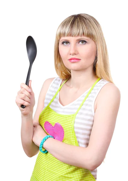 Beautiful young housewife with big spoon isolated on white — Stock Photo, Image
