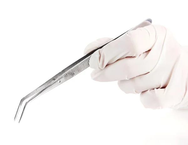 Medical tweezers in hand isolated on white — Stock Photo, Image