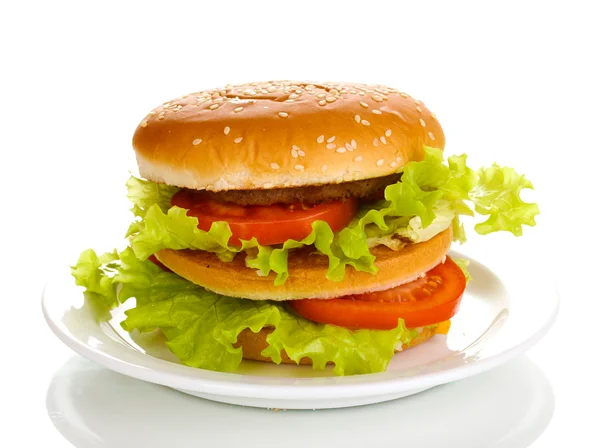 Grande e gustoso hamburger su piatto isolato su bianco — Foto Stock