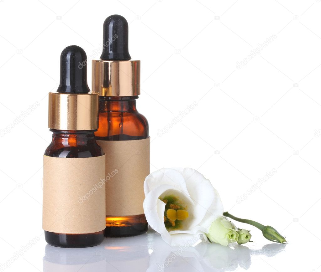 Bottles with essence oil and flower isolated on white
