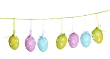 Colorful easter eggs hanging on ribbons isolated on white clipart