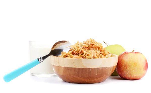Tasty cornflakes in wooden bowl, apples and glass of milk isolated on white — Stock Photo, Image