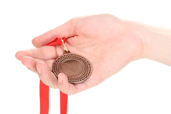 stock image Bronze medal in hand isolated on white