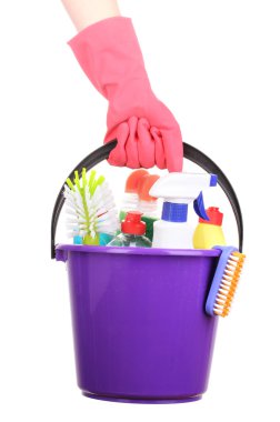 Bucket with cleaning items in hand isolated on white clipart