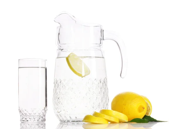 Pitcher and glass of lemonade and lemons isolated on white — Stock Photo, Image