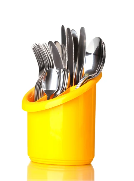 Keuken bestek, messen, vorken en lepels in gele stand geïsoleerd op wit — Stockfoto
