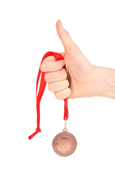 Bronze medal in hand isolated on white — Stock Photo, Image