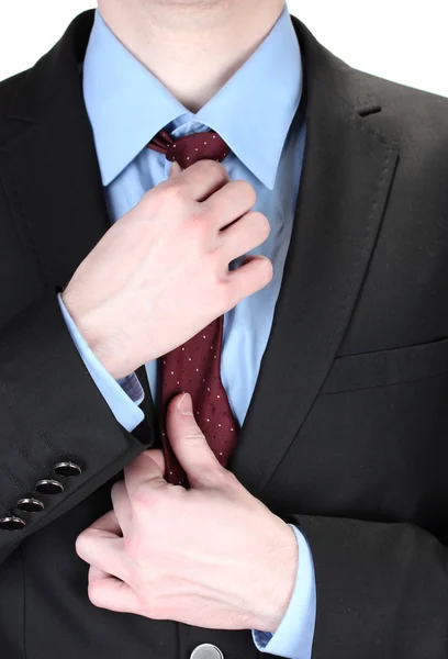 Businessman correcting a tie close up — Stock Photo, Image