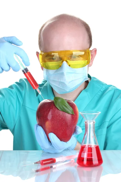 Scientist injecting GMO into the apple — Stock Photo, Image