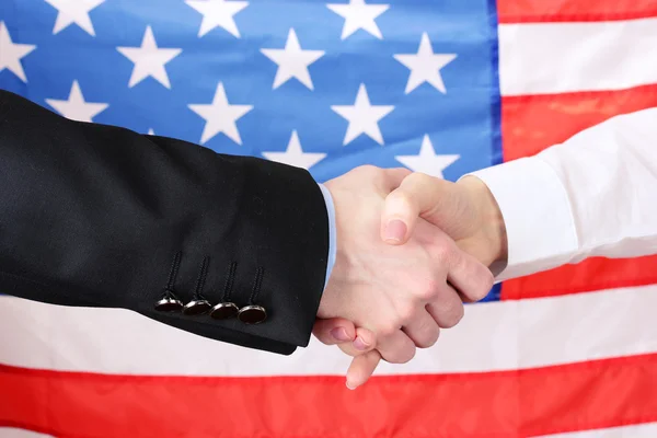Business handshake on american flag background — Stock Photo, Image
