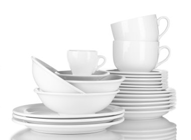 Empty bowls, plates and cups on gray background clipart