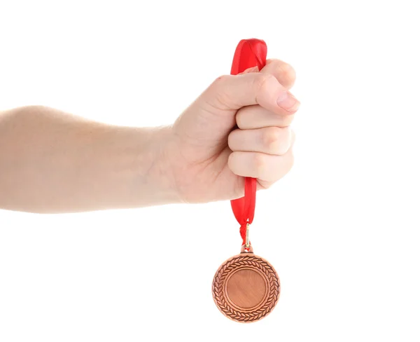 Bronzová medaile v ruce izolované na bílém — Stock fotografie