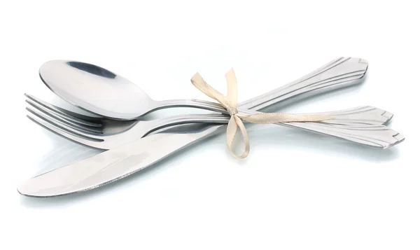 Silver fork, spoon and knife tied with ribbon isolated on white — Stock Photo, Image