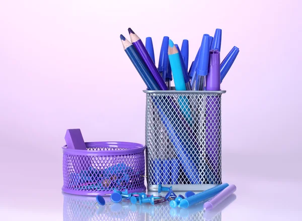 Color holders for office supplies with them on bright colorful background — Stock Photo, Image