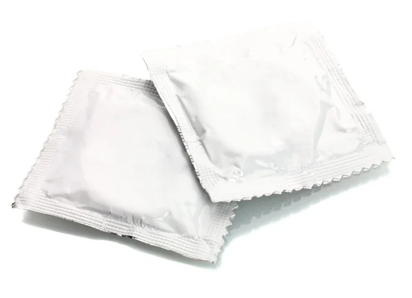 Dois preservativos isolados em branco — Fotografia de Stock