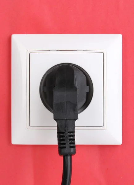 White electric socket with plug on the wall — Stock Photo, Image